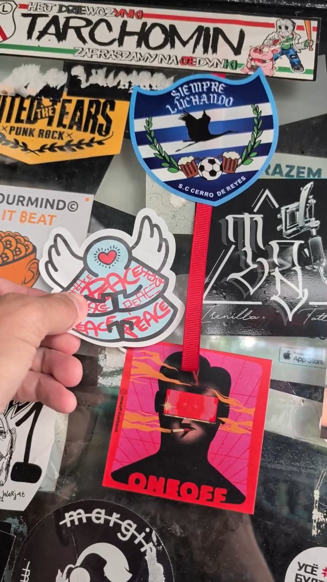 Sticker slapping in Praga, Warsaw Poland